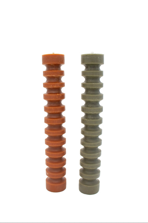 The authentic candle company orange and olive ridged pillar