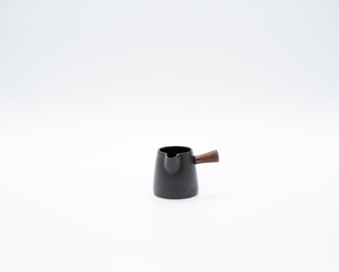 Mark Mitchell handmade black ceramic milk jug with small wooden handle