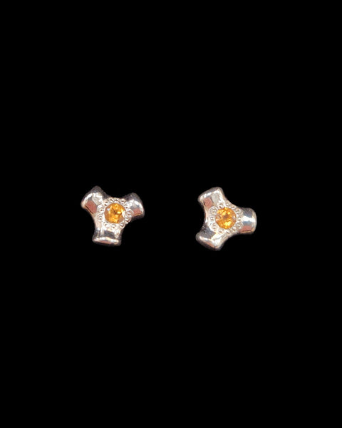 Pair of silver knuckle stud earrings with orange gemstones 